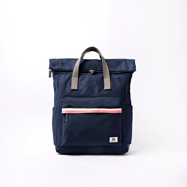 Medium nylon backpack, navy blue with front pocket and top handles.