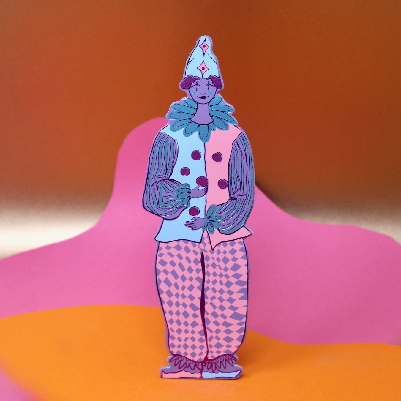 Clown-shaped leather bookmark in light blue with patterned pants and bow collar