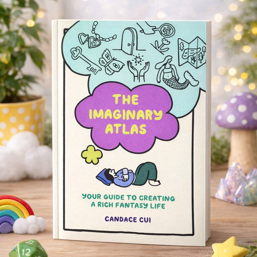 Illustrated hardcover journal with turquoise and purple cover art and title badge