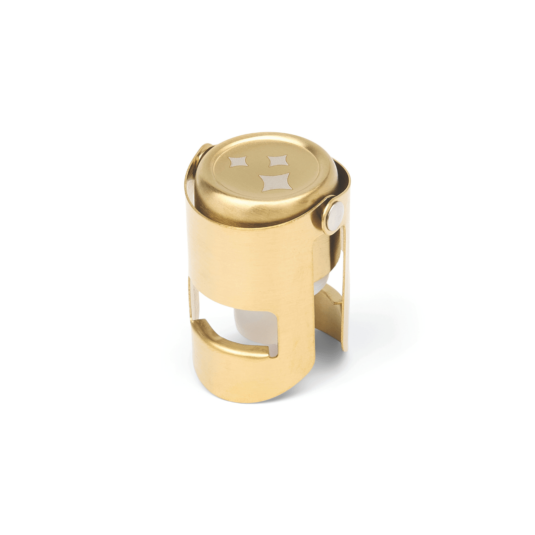 Gold champagne bottle stopper with decorative star button top