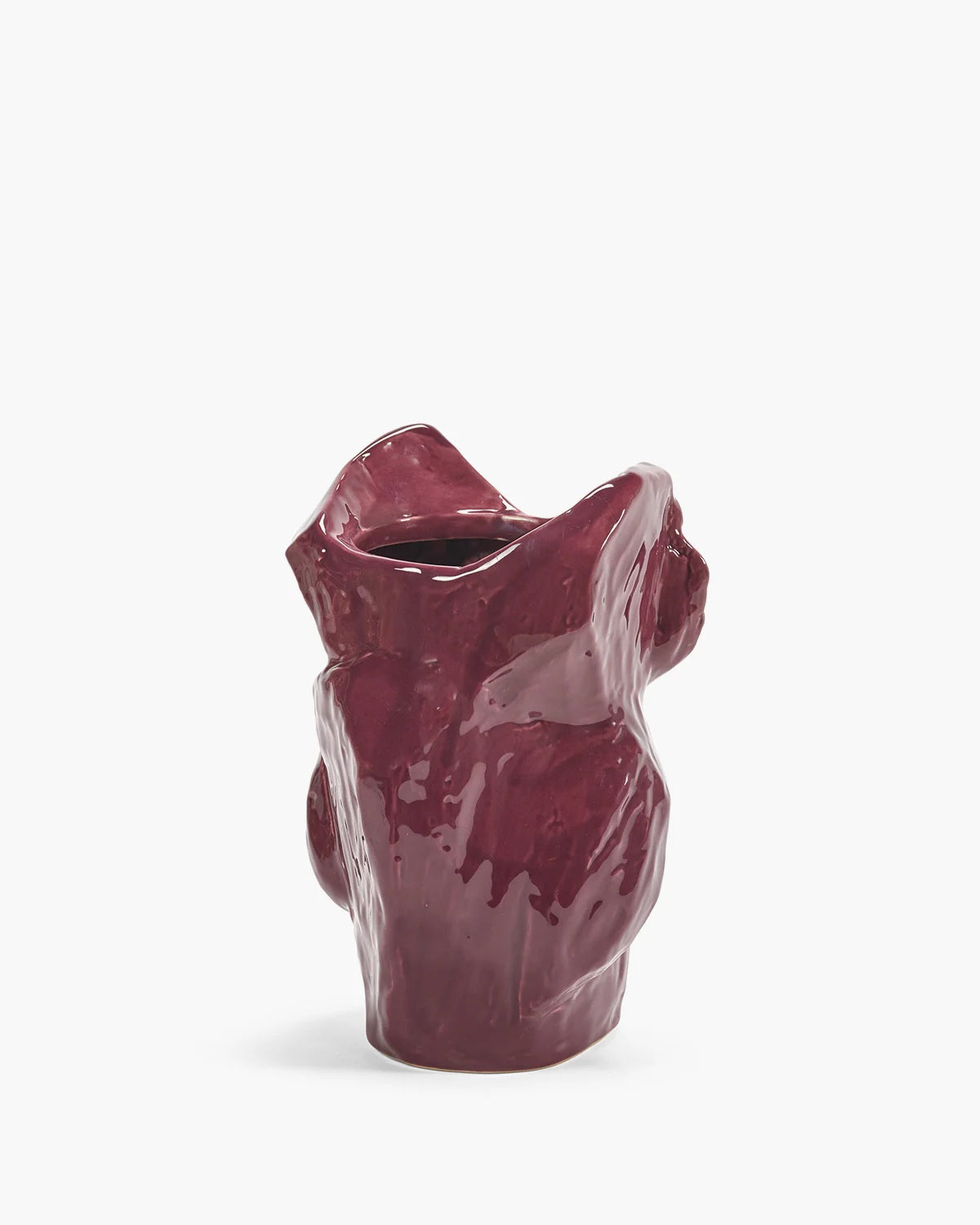 Glazed aubergine owl vase, angled view showing carved wings and open top