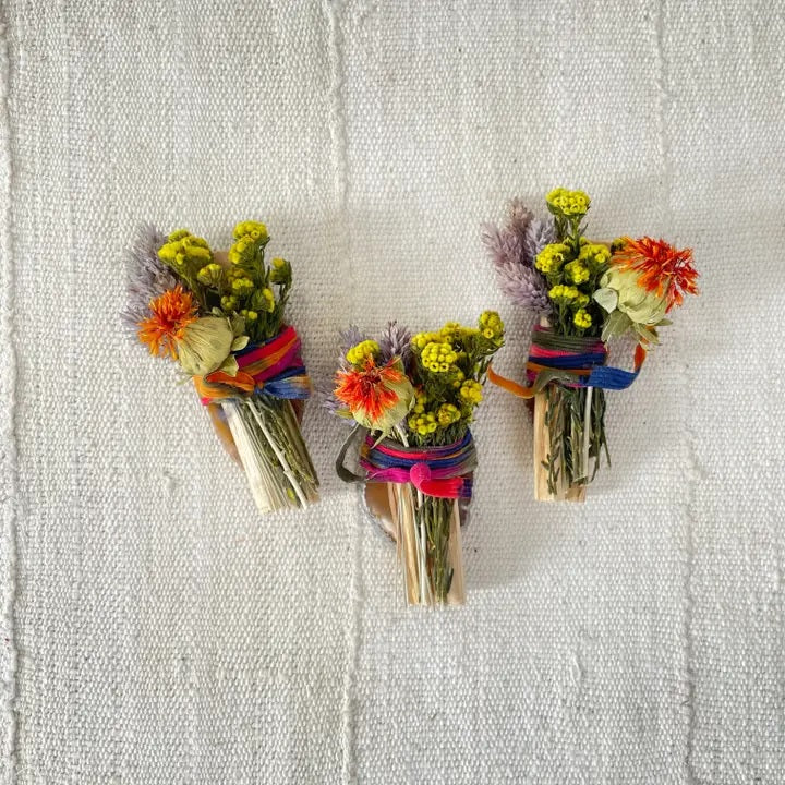 Wood Creek Palo Santo bundle: three dried-flower sticks tied with colorful ribbon