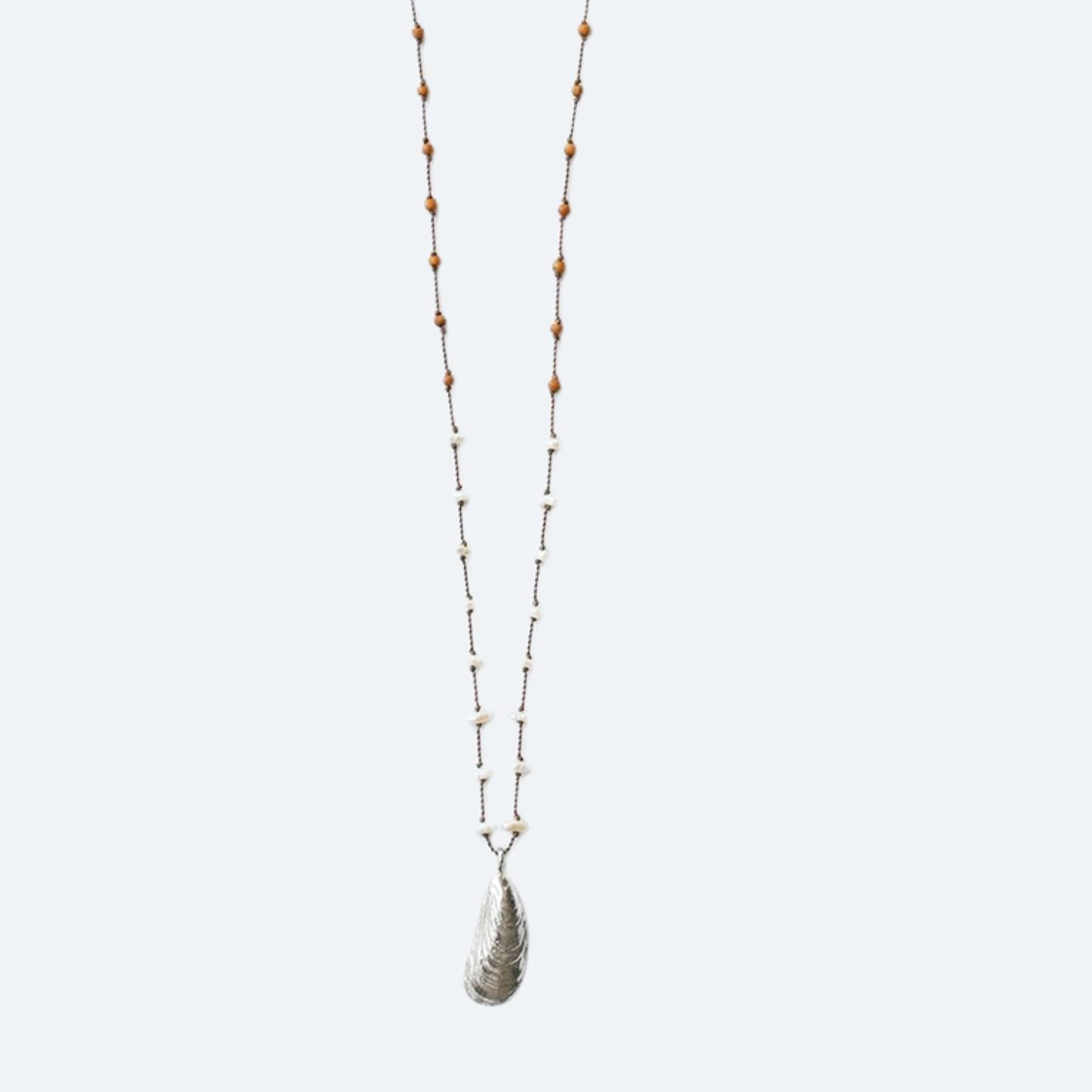 Beaded shell pendant necklace with wood beads and white accents