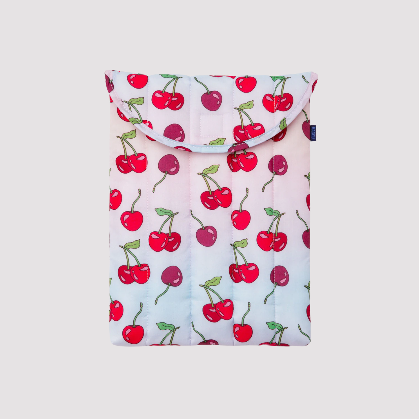 White puffy 13"/14" laptop sleeve with red cherry pattern and top flap.
