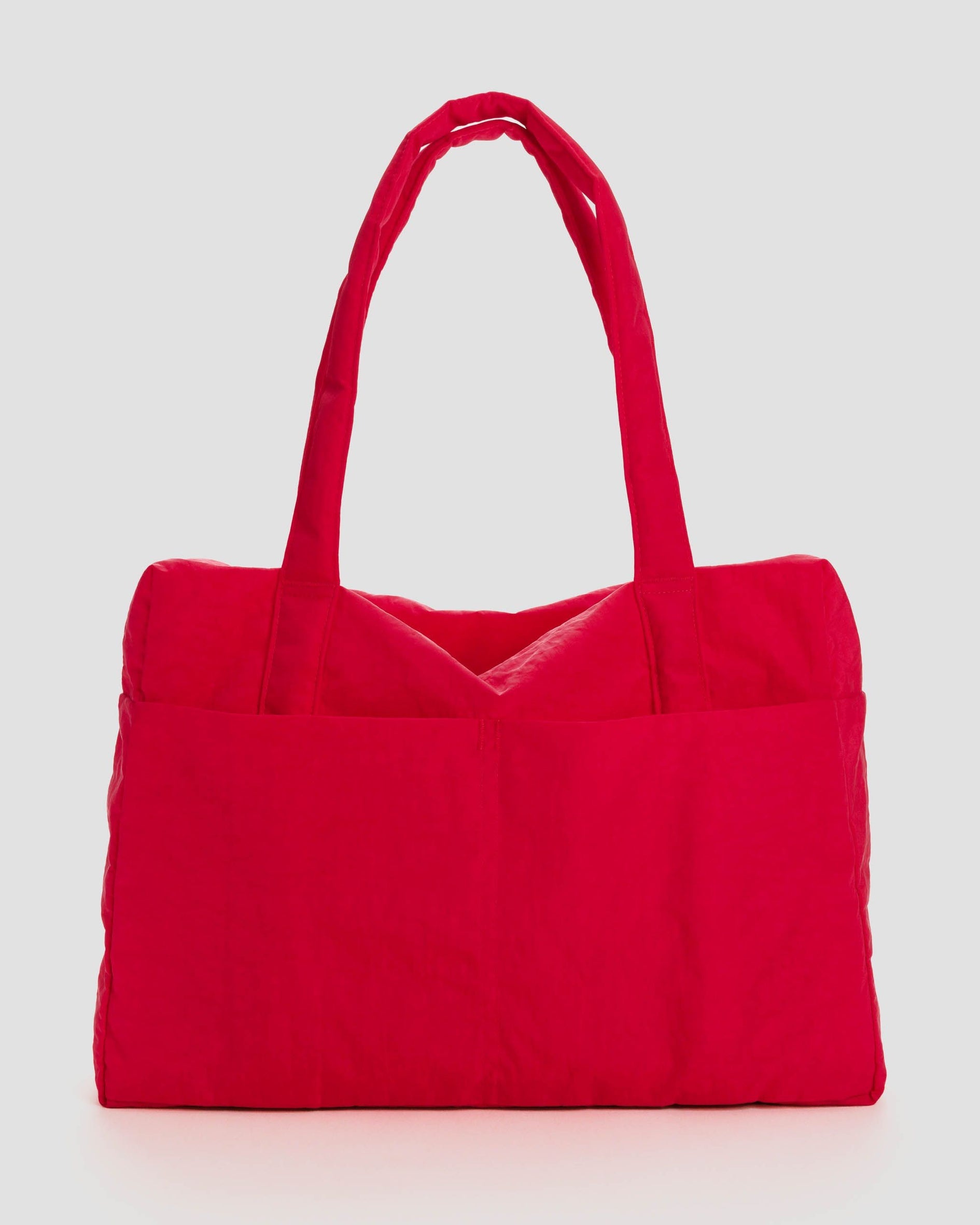 Carry-on travel bag in bright red with short top handles and padded base.