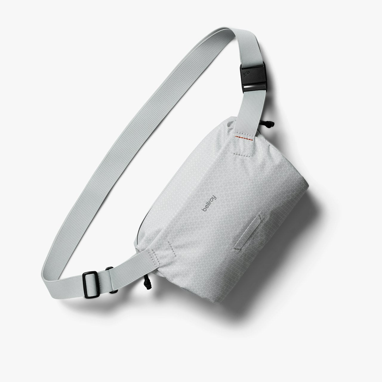 Mini sling bag in light gray with adjustable strap and compact front panel.