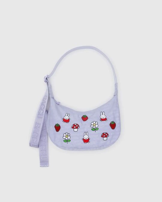 Small crescent nylon crossbody bag in light purple with cute animal pattern and tag
