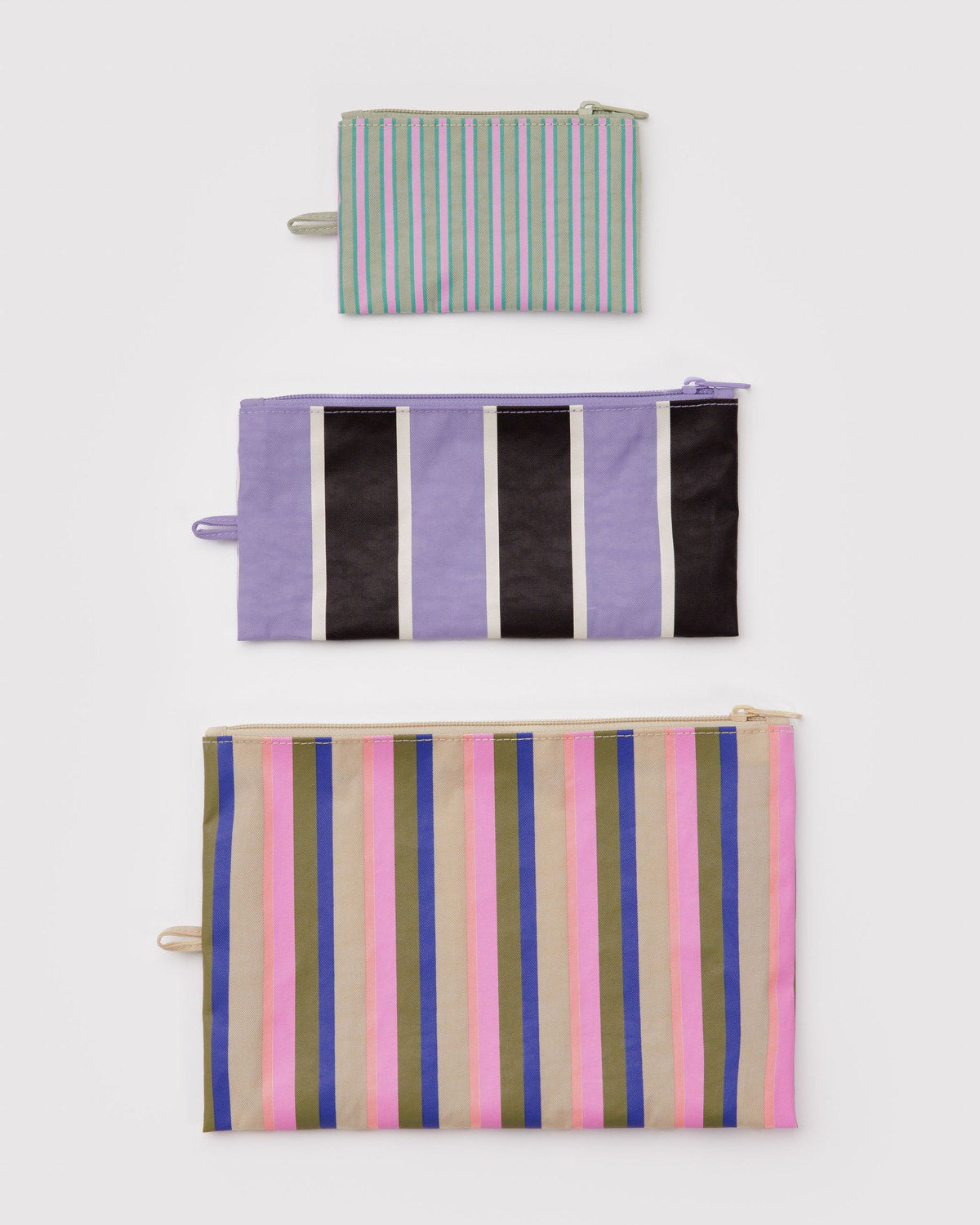 Set of three flat zipper pouches with vertical striped prints in black, white, and pink