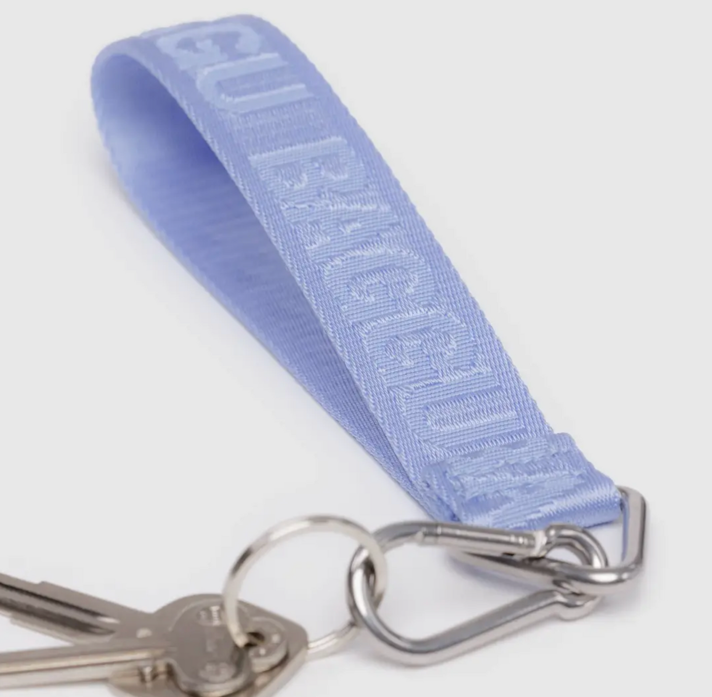 Light blue BAGGU logo keychain with silver carabiner clip and keyring