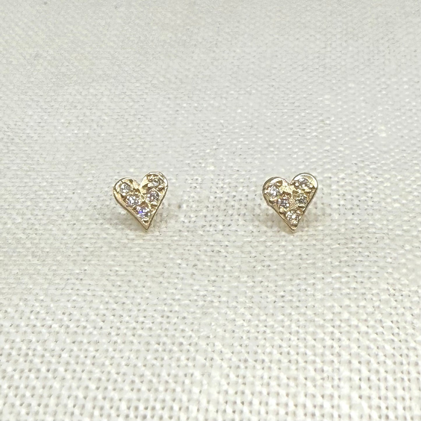 Pave diamond heart stud earrings in 14 karat gold
