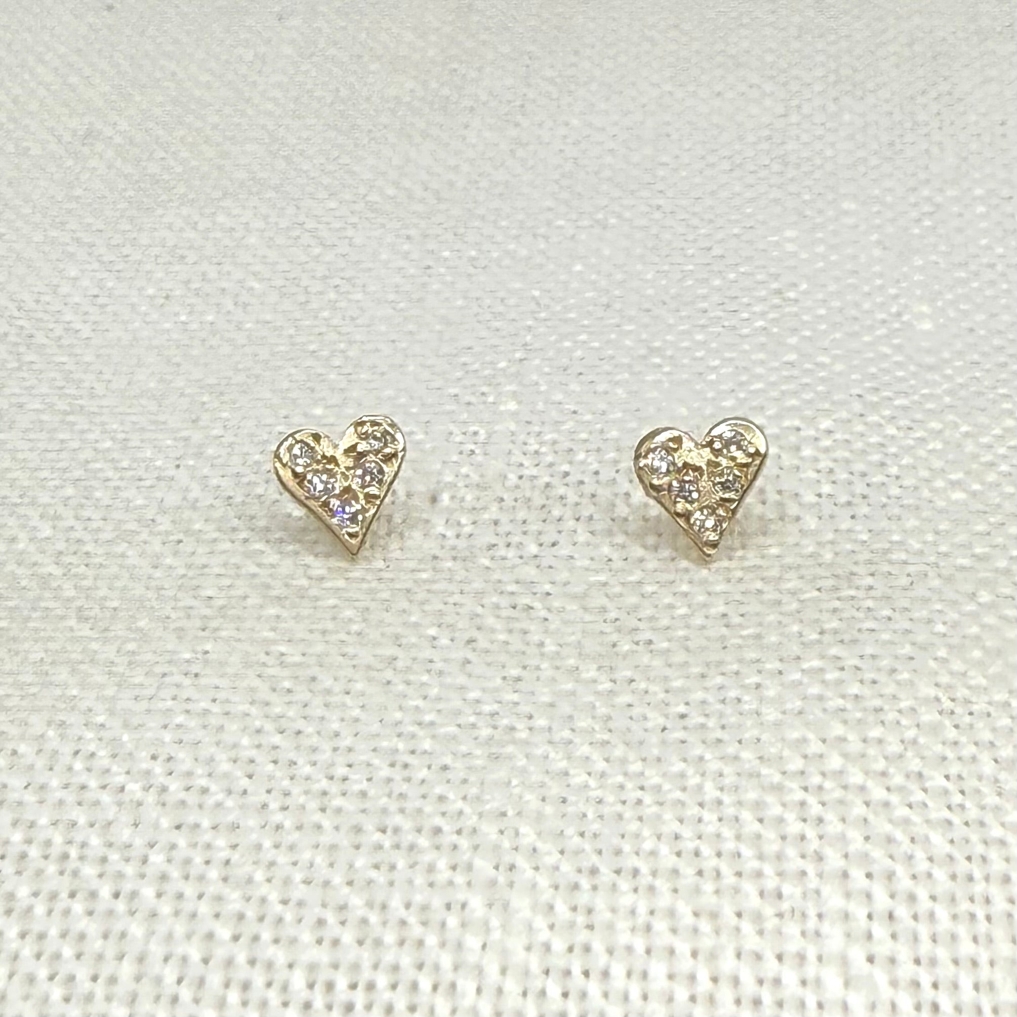 Pave diamond heart stud earrings in 14 karat gold