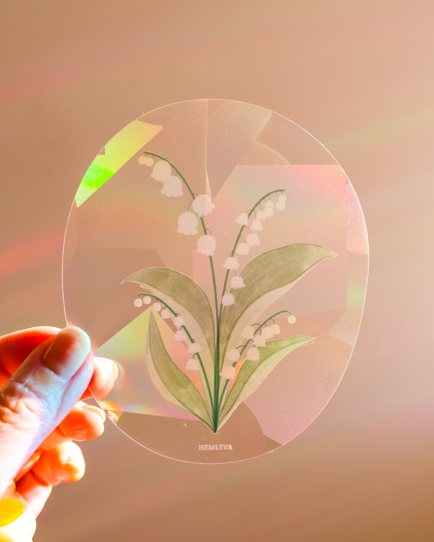 Medium circular suncatcher with lily of the valley bouquet artwork in soft colors