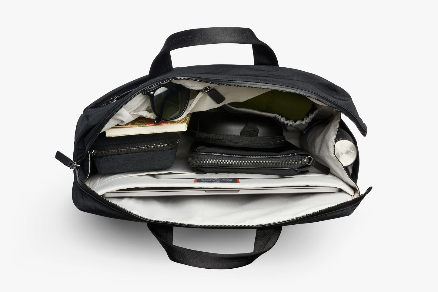 Open navy work bag showing interior slip pockets and zip organizer
