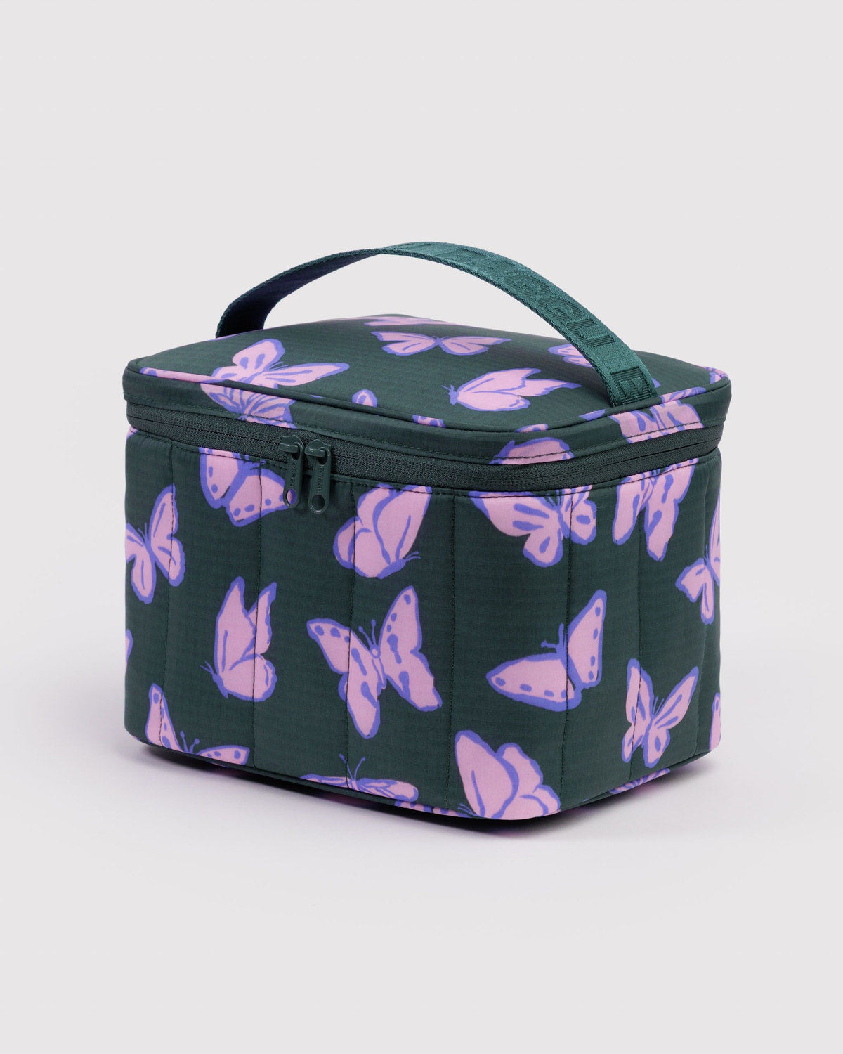 Puffy lunch bag with purple butterfly print on dark green, zipper and handle