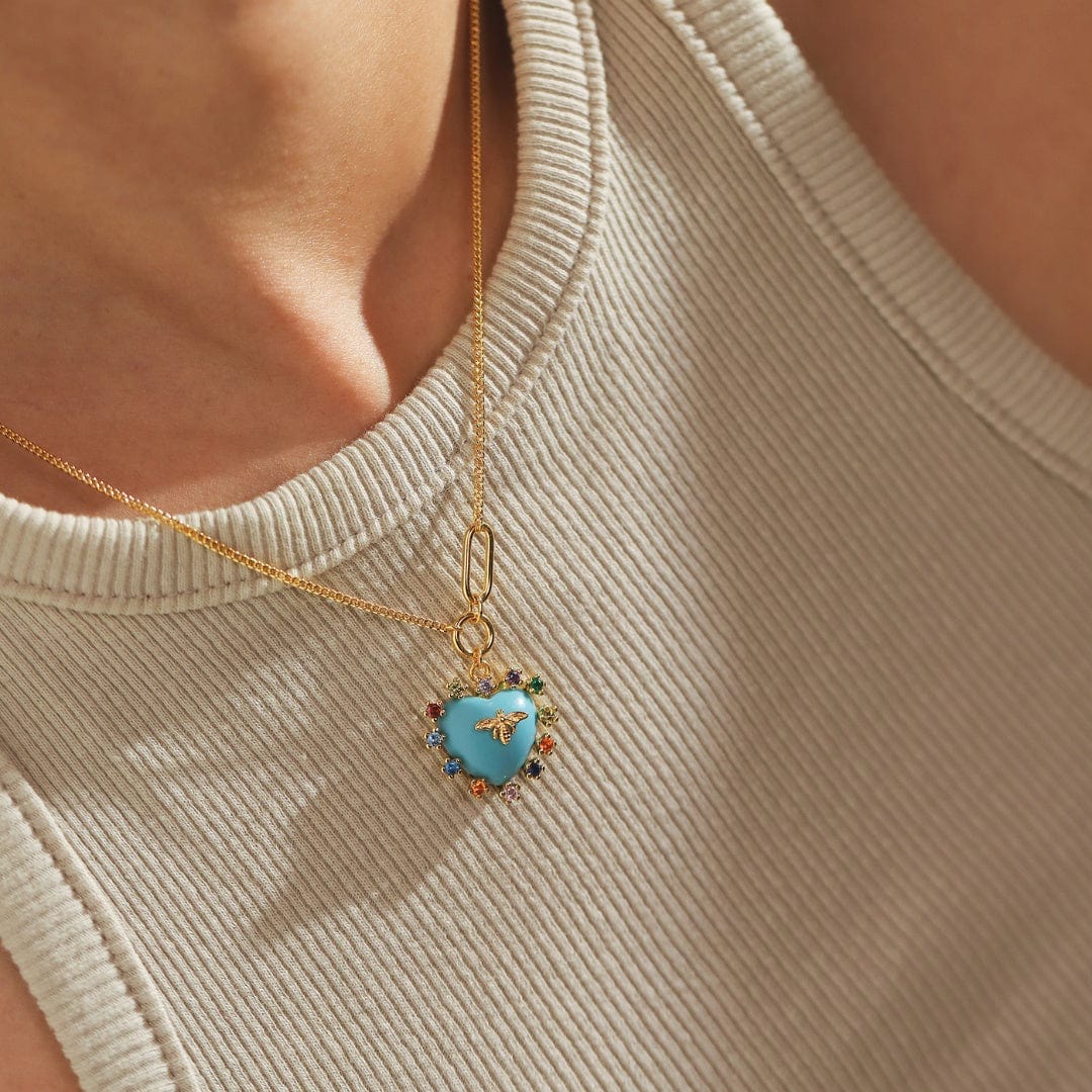 Gold chain heart pendant necklace with turquoise bee charm and multicolor bead details