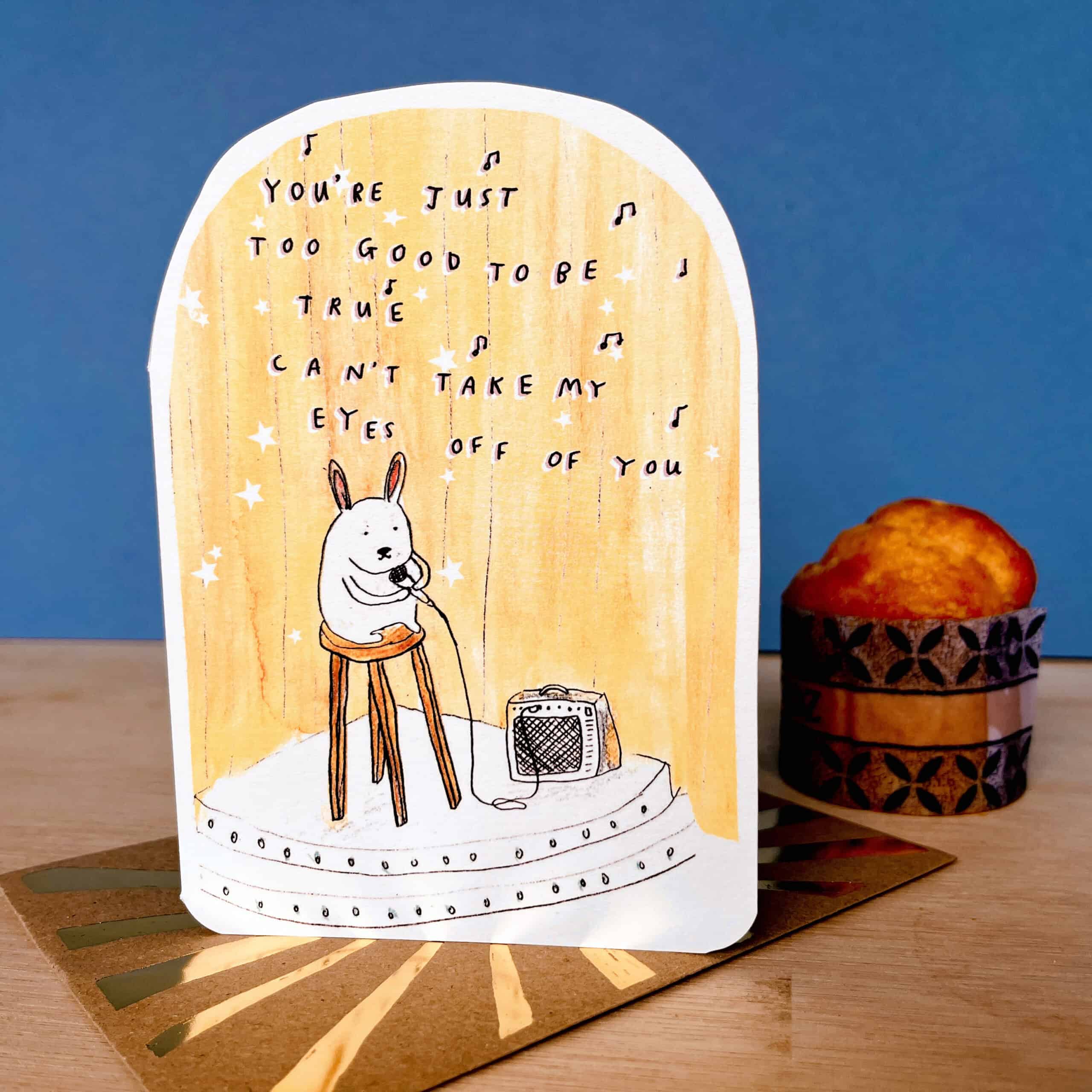 Bunny greeting card with white rabbit on stage and microphone illustration