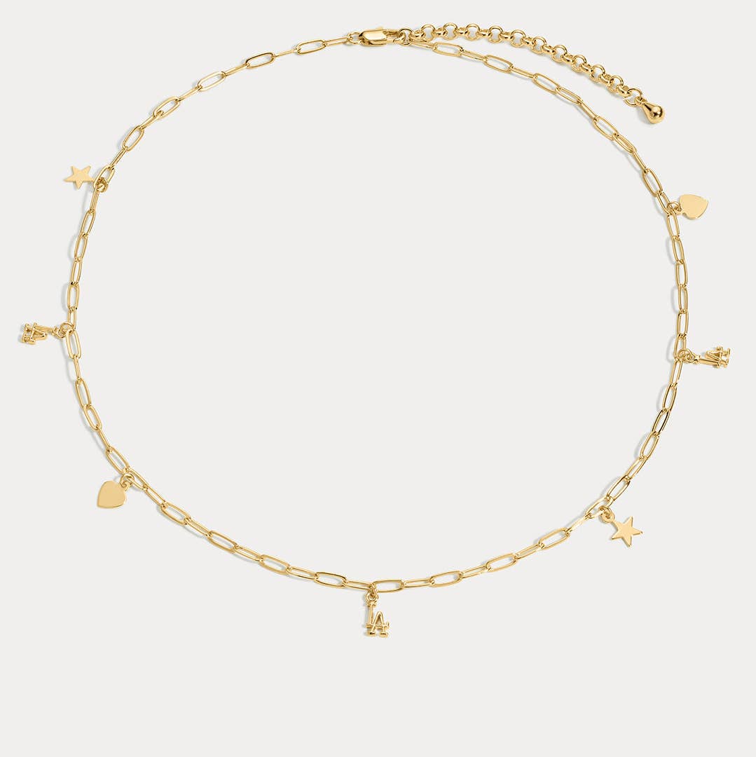 Gold charm necklace with heart and star charms, central Dodgers logo pendant