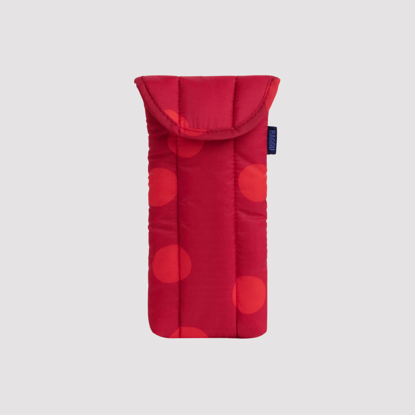Puffy glasses sleeve in red with large dot pattern and padded flap closure