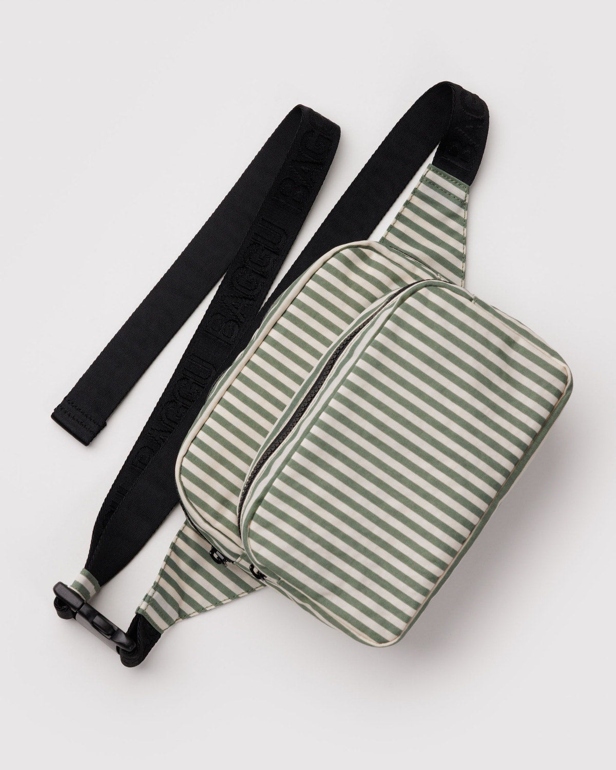 Sage striped waist bag with front zip pocket, top zipper, and black adjustable strap
