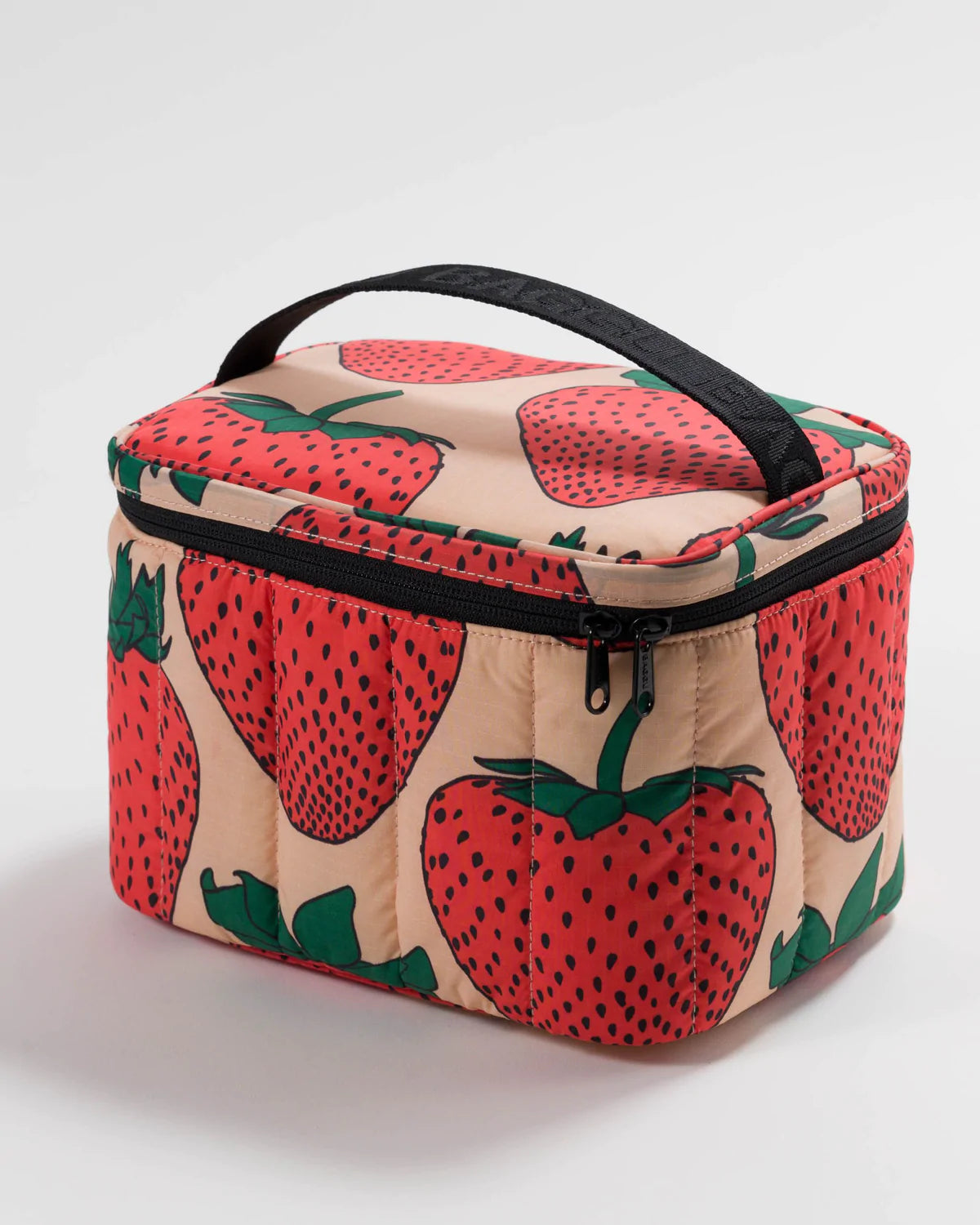 Puffy lunch bag with strawberry-and-leaf print, black handle, and zipper top