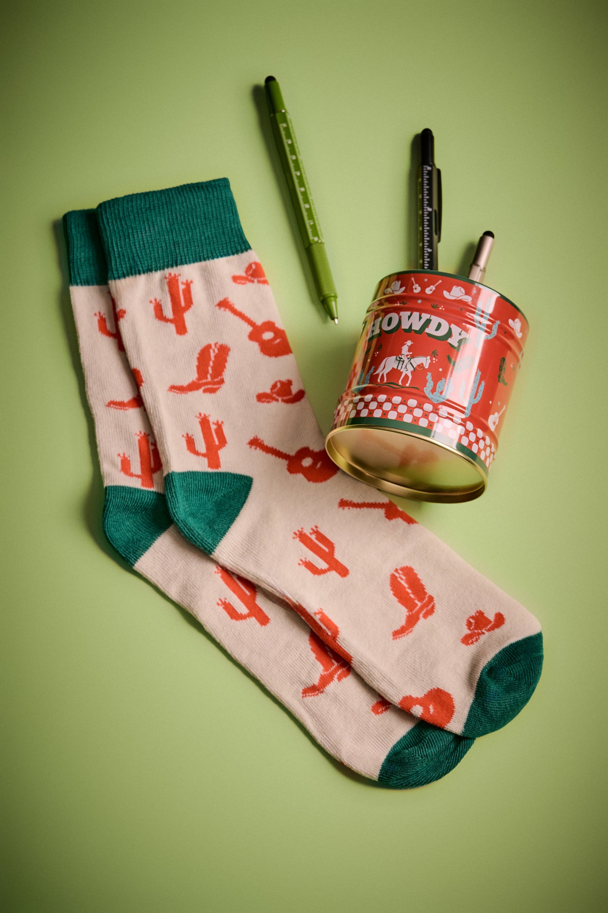 Howdy socks, cream with red cactus print and green toe/heel cuffs