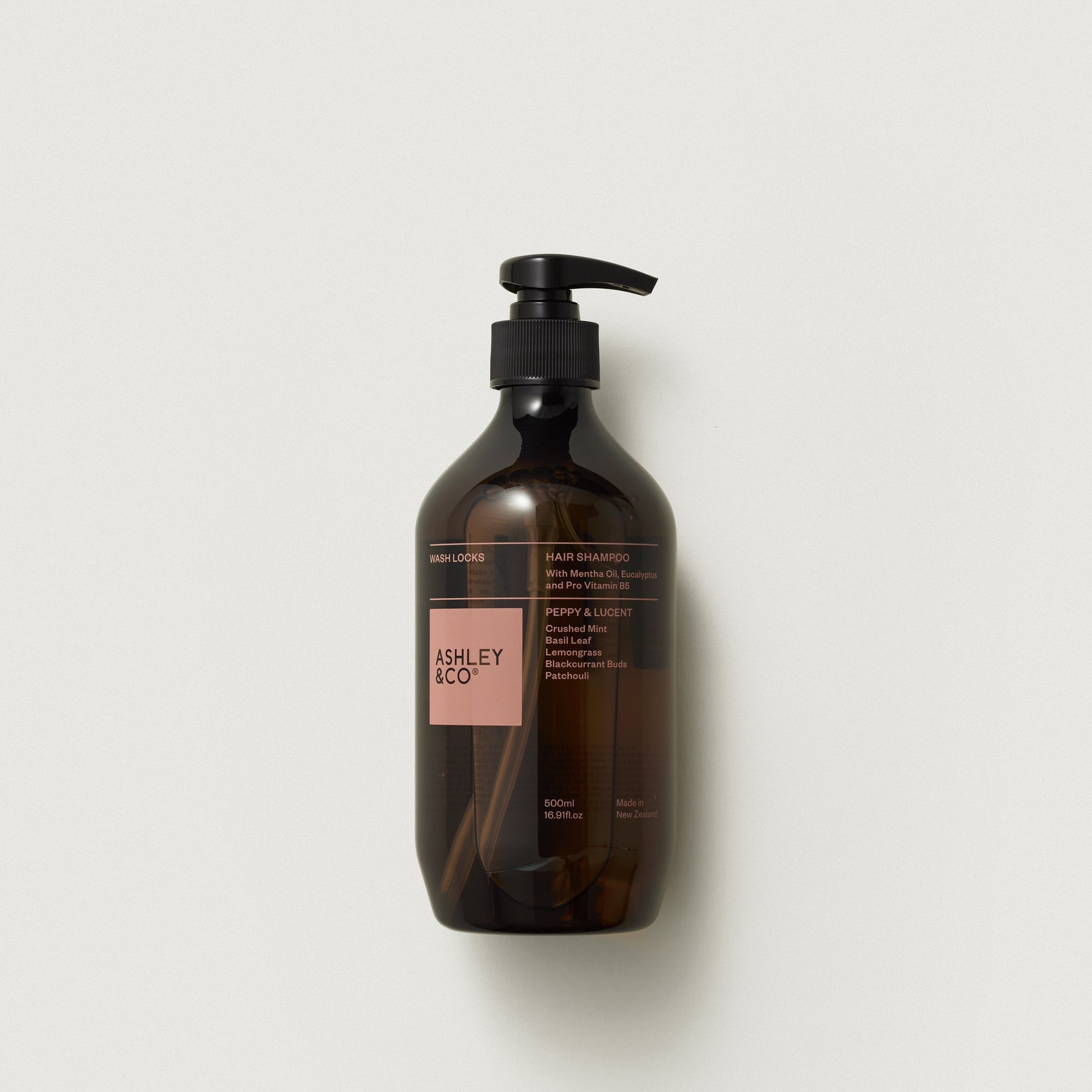 Amber hair shampoo bottle with black pump, Ashley & Co label