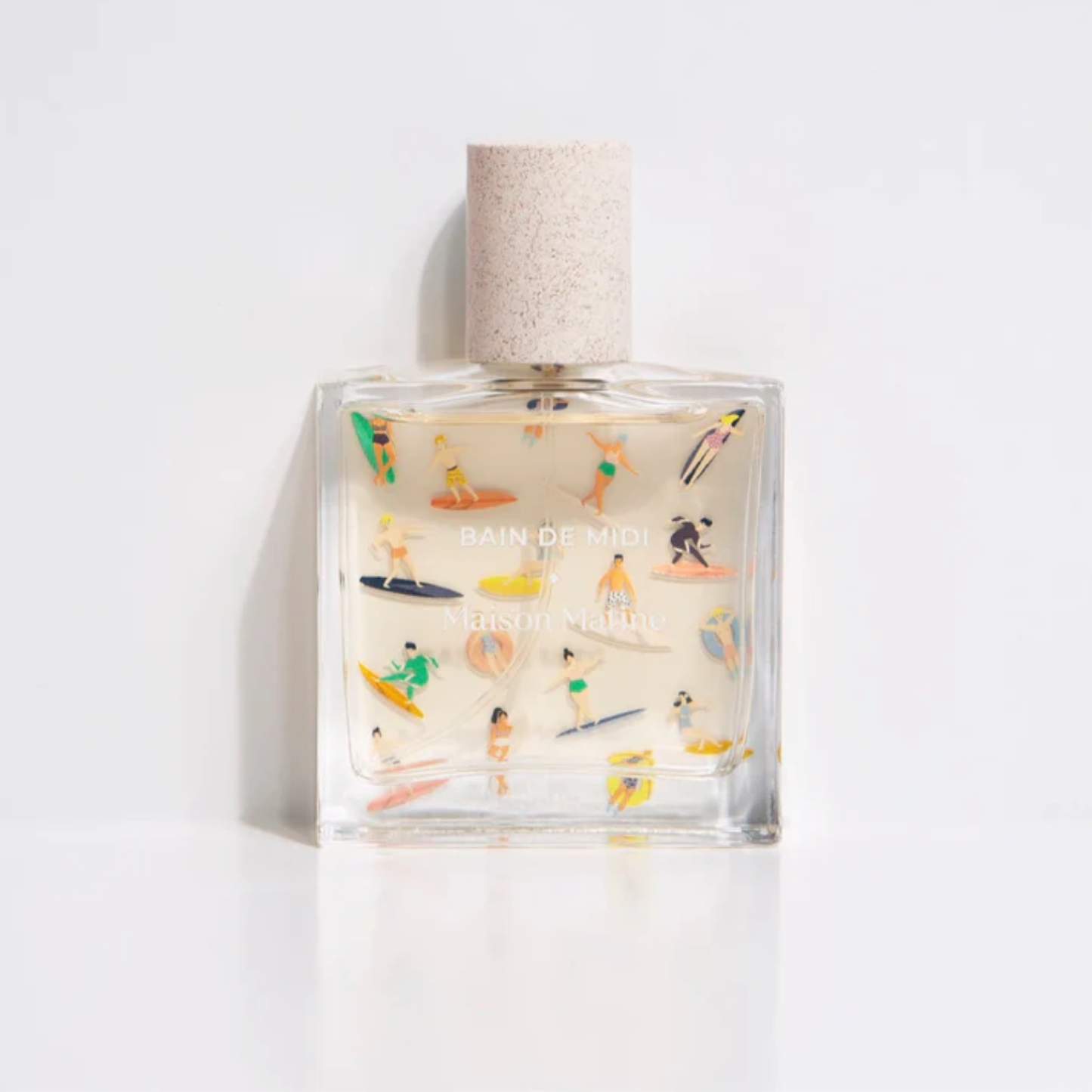 Clear glass eau de parfum bottle with cork top and illustrated Maison Matine label