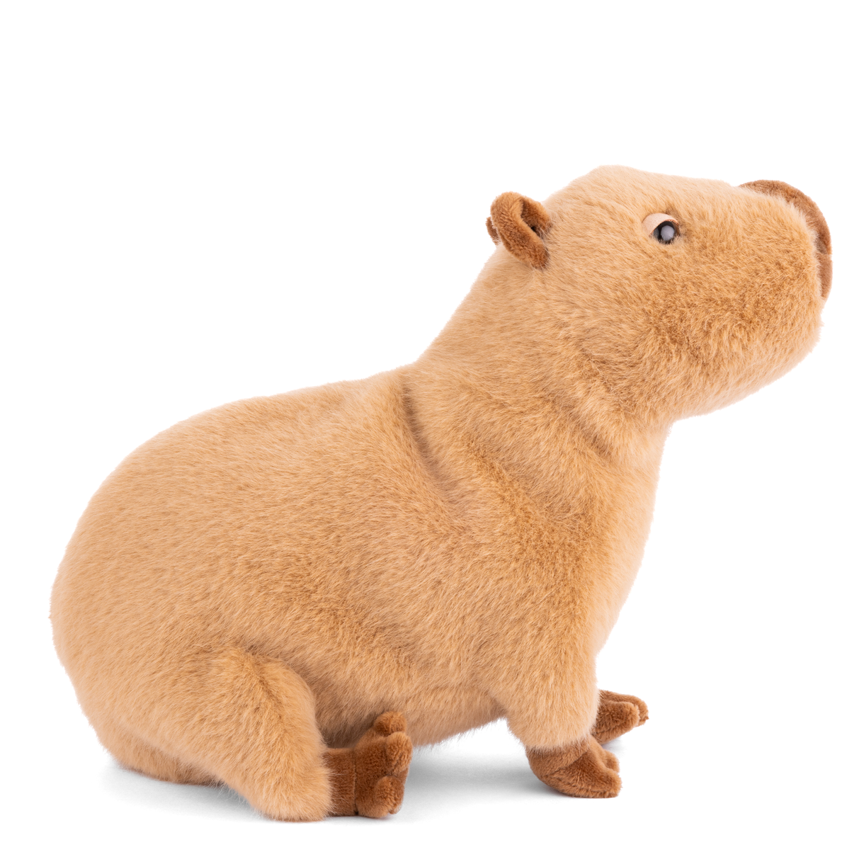 Capybara plush toy, tan body with darker brown ears and paws, side view
