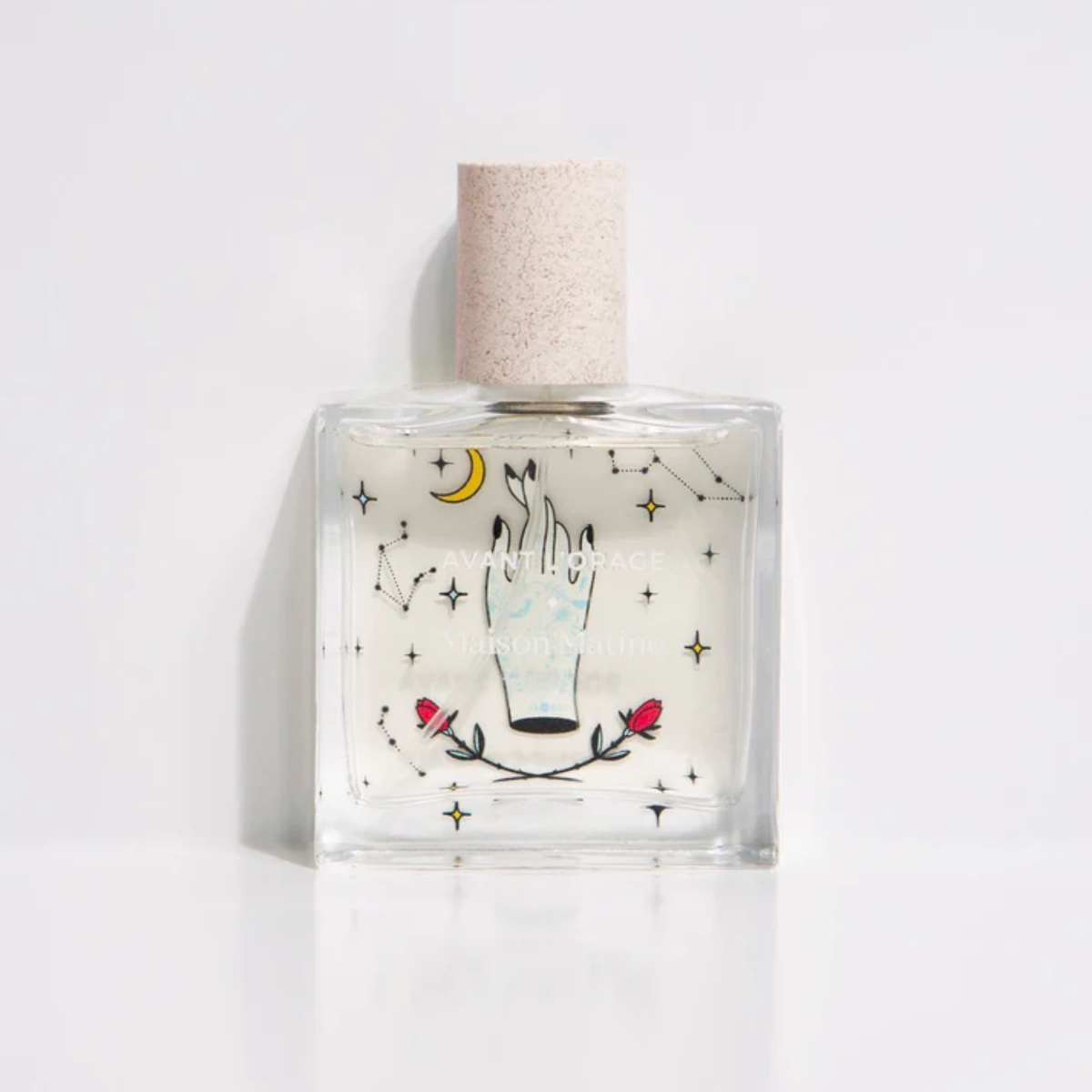 Avant l'Orage eau de parfum bottle, clear glass with illustrated label and cork cap