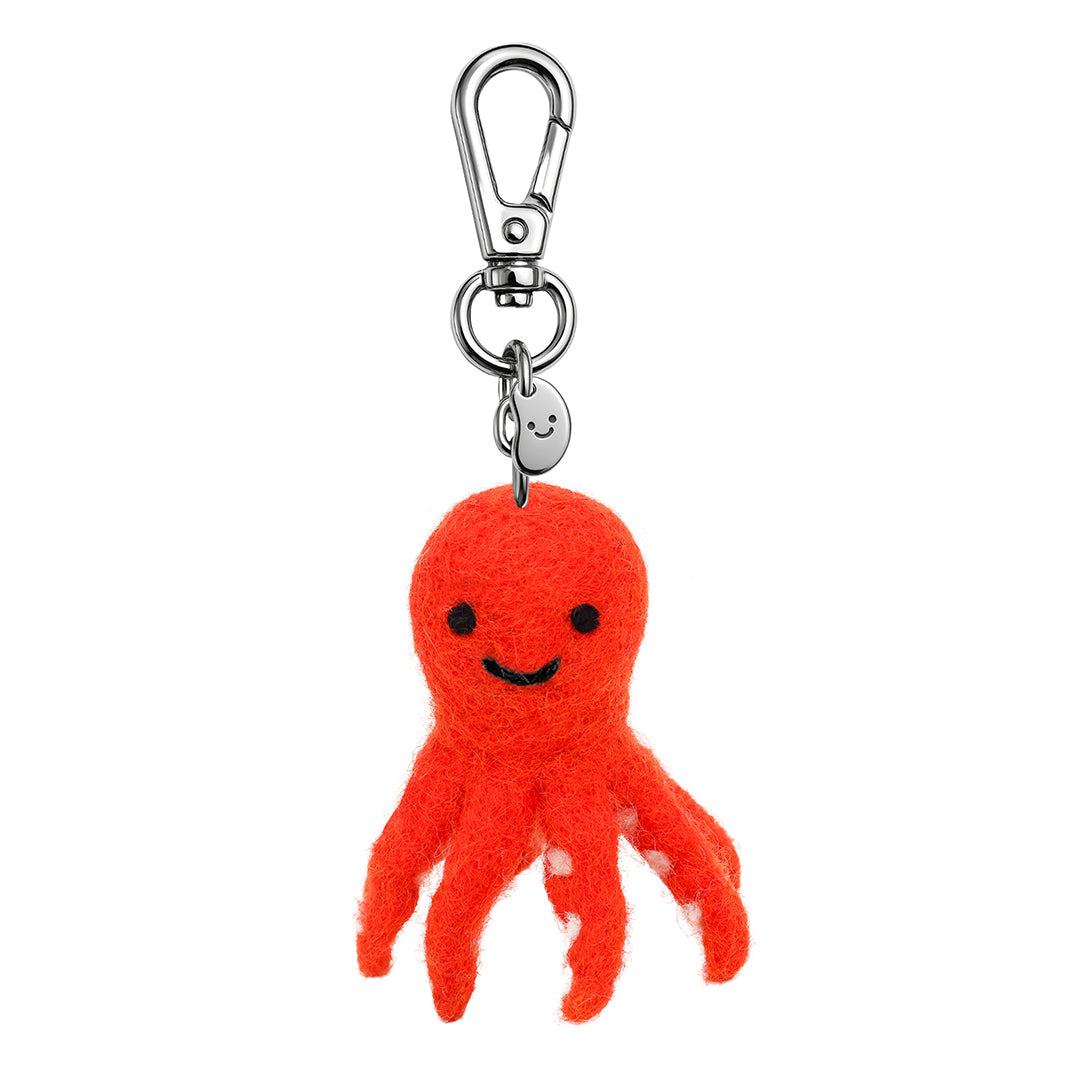 Orange felt octopus keychain with smile face and metal clip