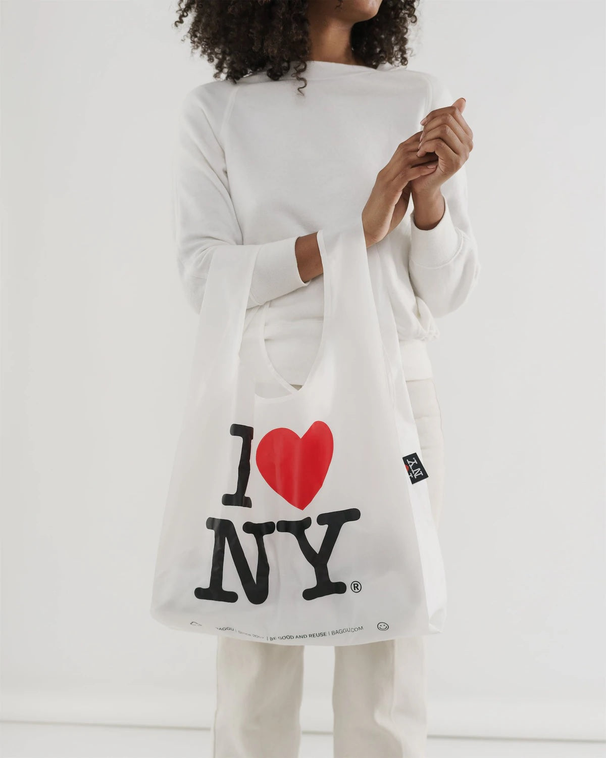 Reusable tote bag with red heart and black “I ♥ NY” graphic