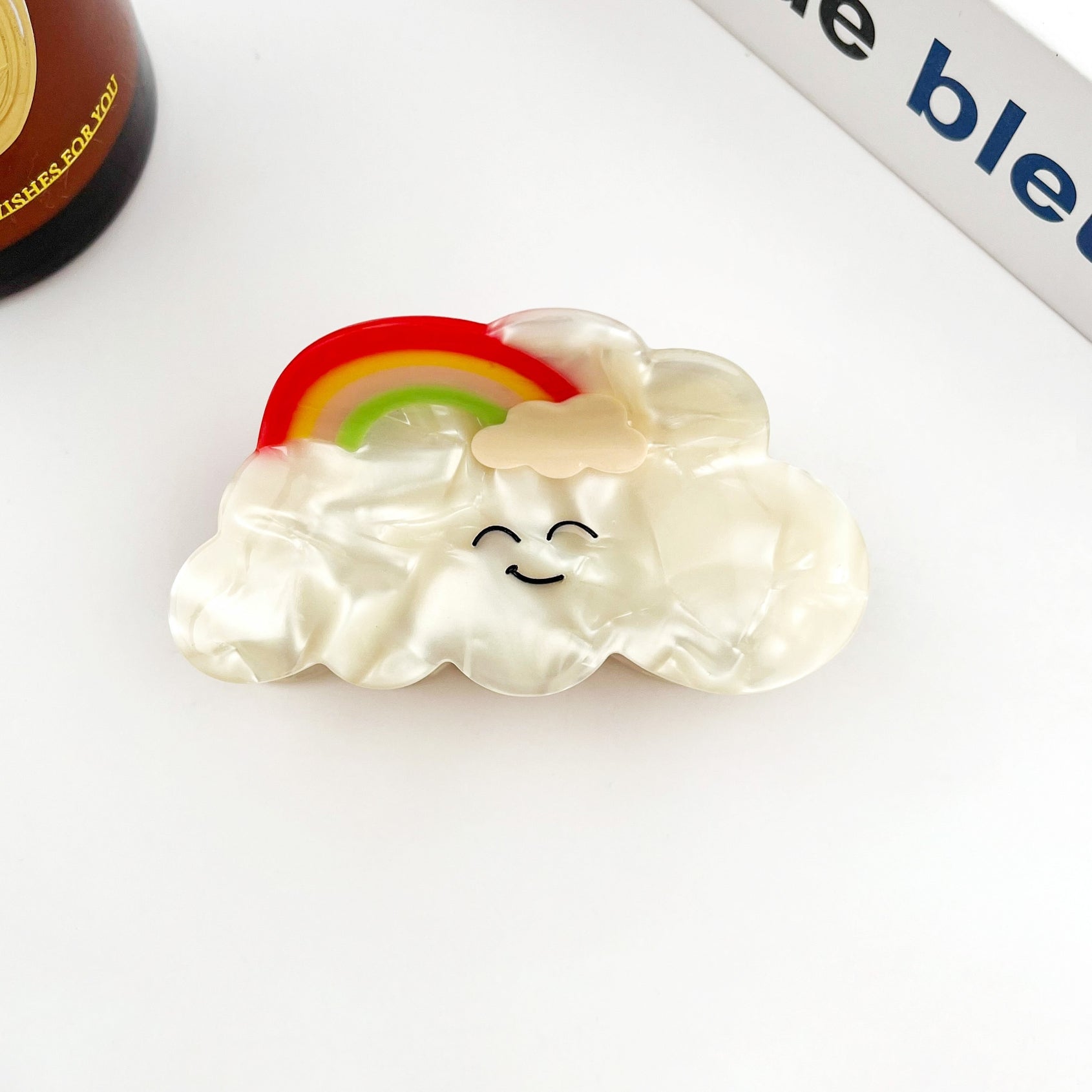 Cream cloud acetate hair clip with rainbow and smiling face