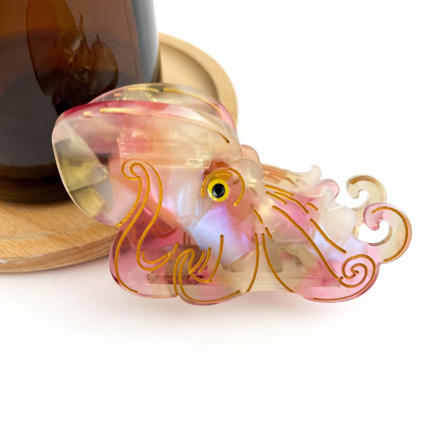 Color-changing octopus claw hair clip with translucent pink and orange tentacles