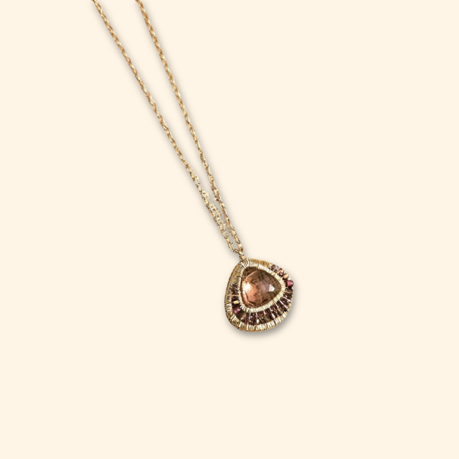 Amethyst pendant necklace with circular double-frame beadwork and gold chain