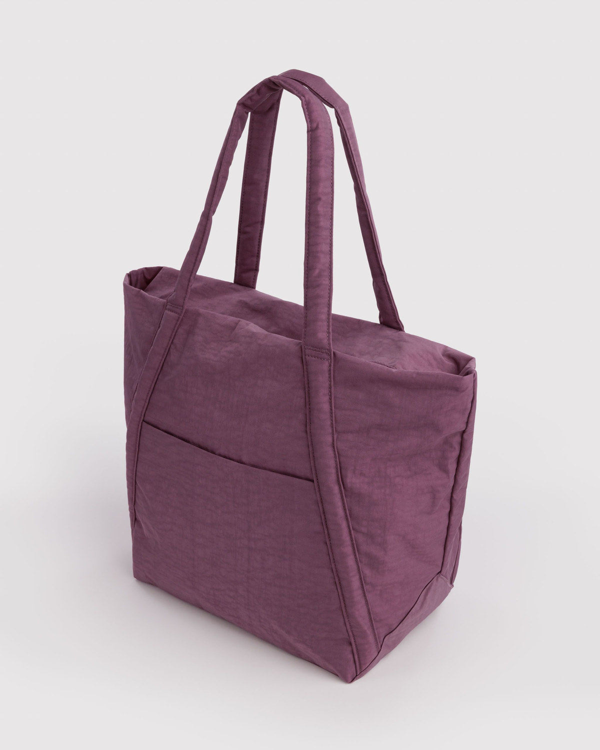Plum tote bag with two top handles, side seams, and a firm boxy bottom.