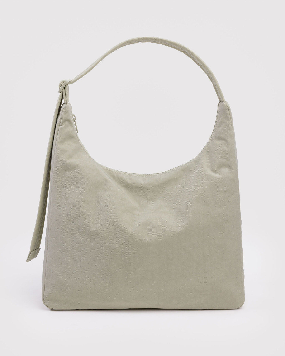 Nylon shoulder bag in light olive green with short top handle and side tassel detail.