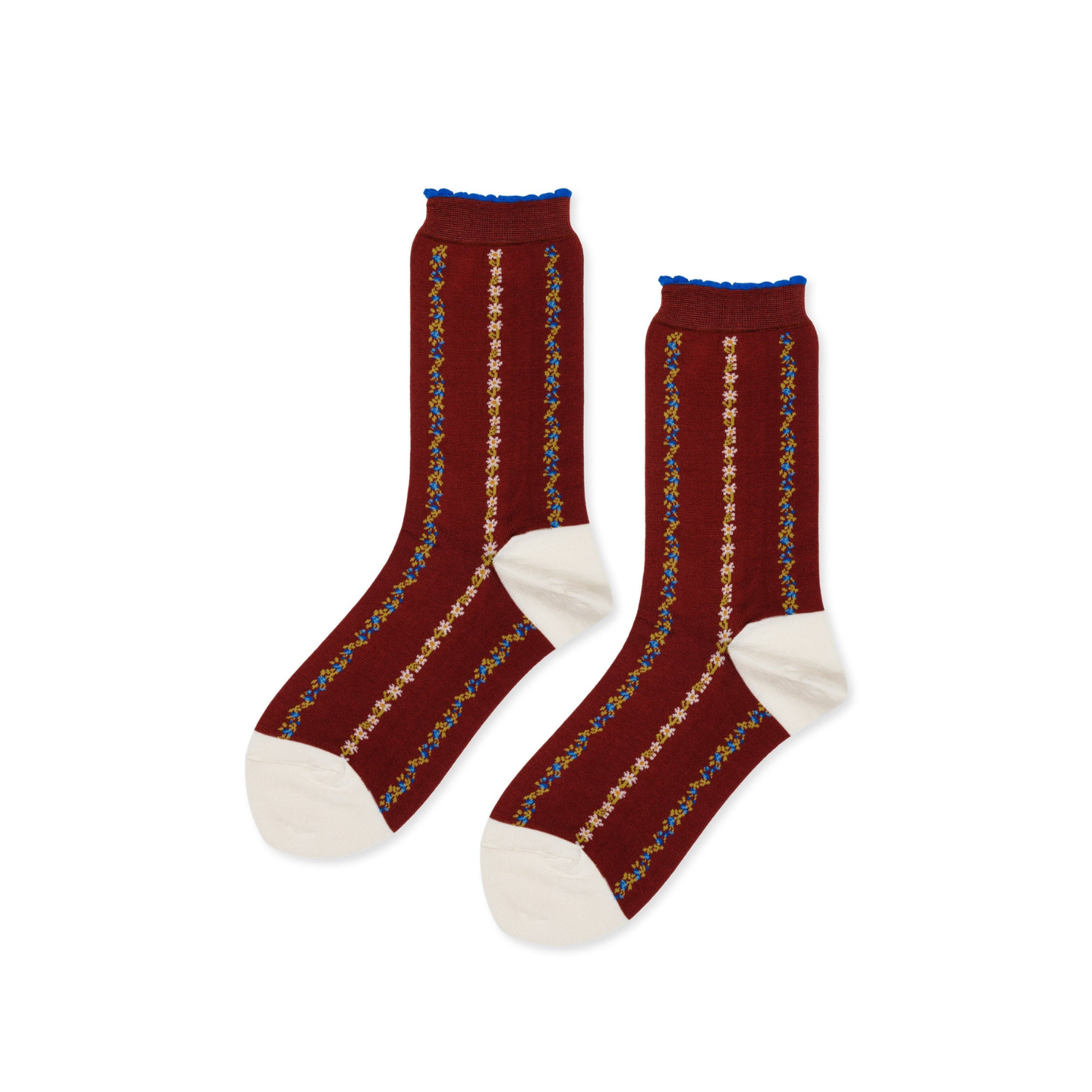 Rust crew socks with blue cuffs and vertical yellow floral stripes, white heel and toe