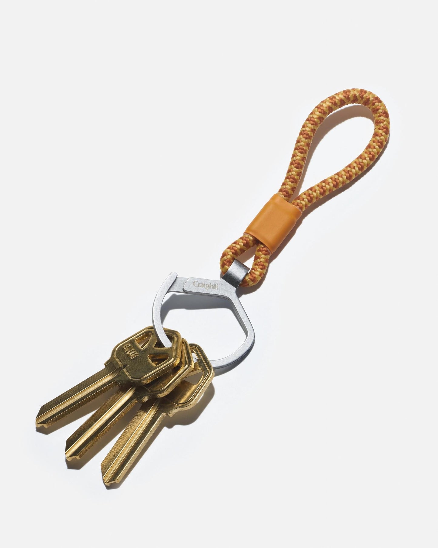 Metal split ring key holder on orange braided rope loop