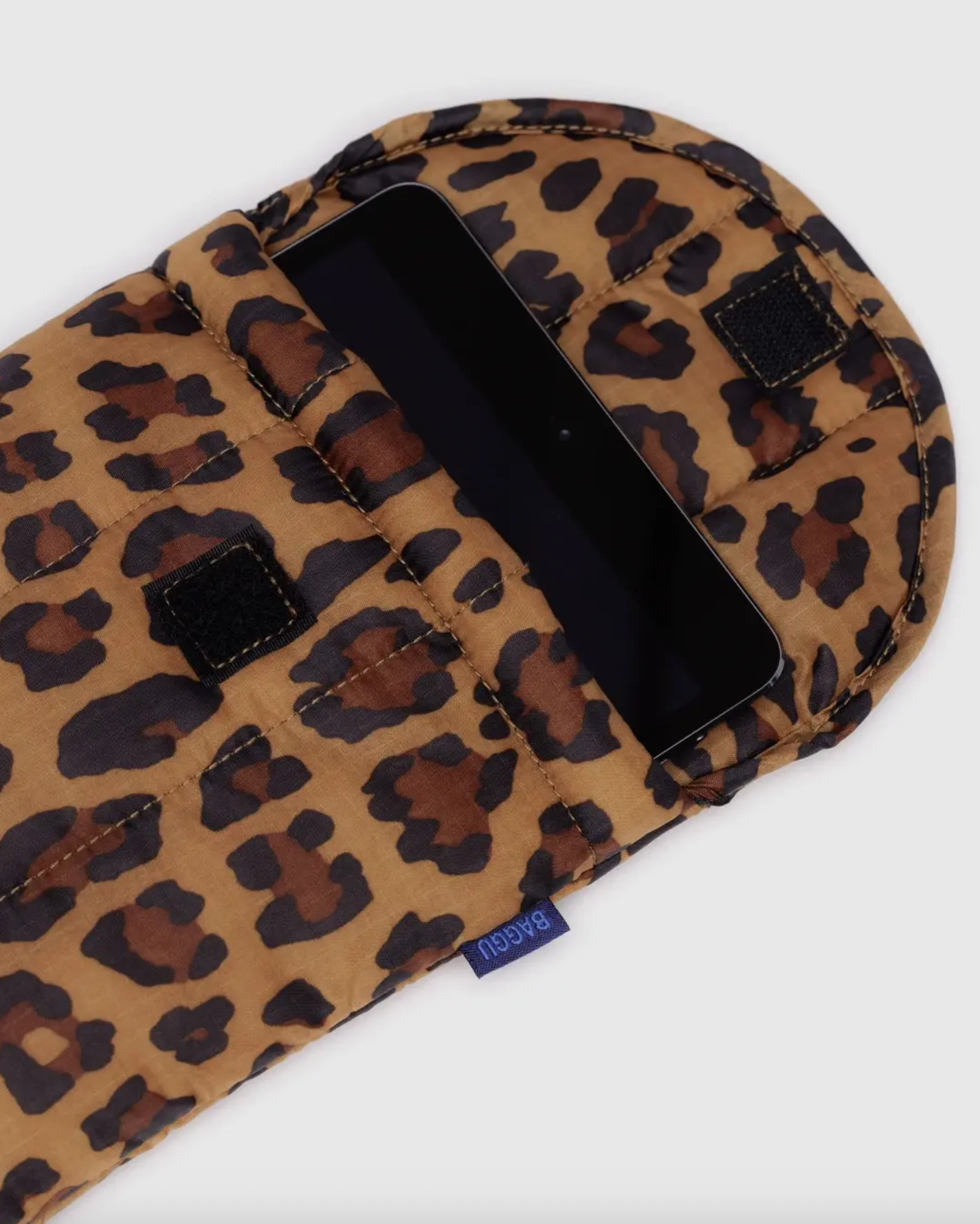 Leopard-print 8-inch tablet sleeve with strap and black fabric corner tabs