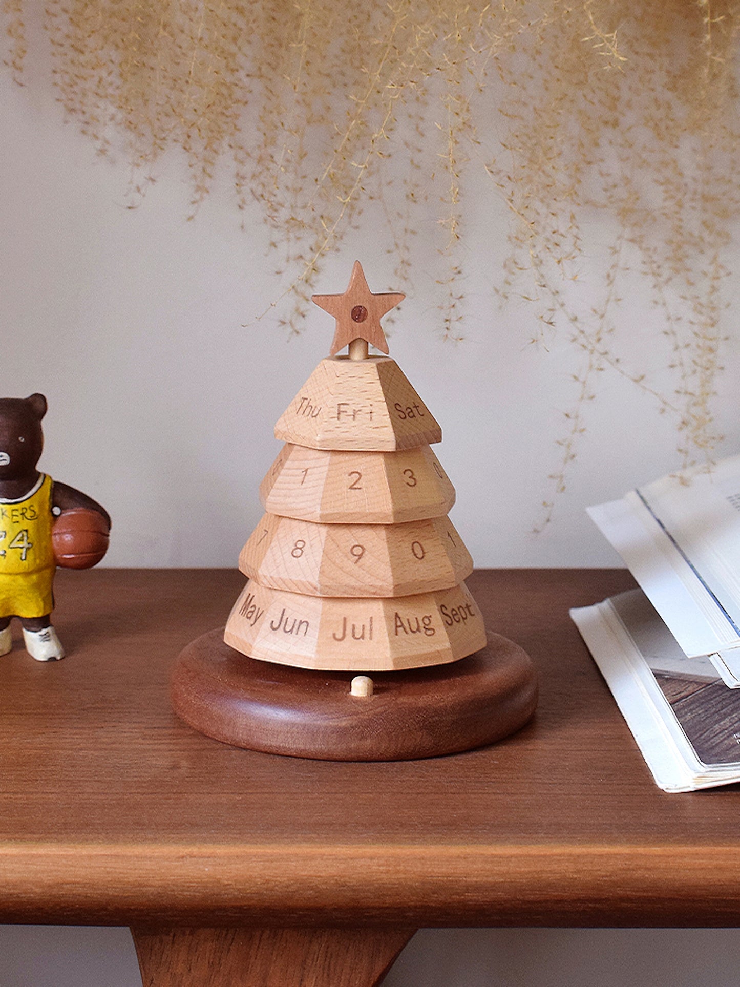 Wooden Christmas tree calendar, star topper and labeled day blocks on wooden base