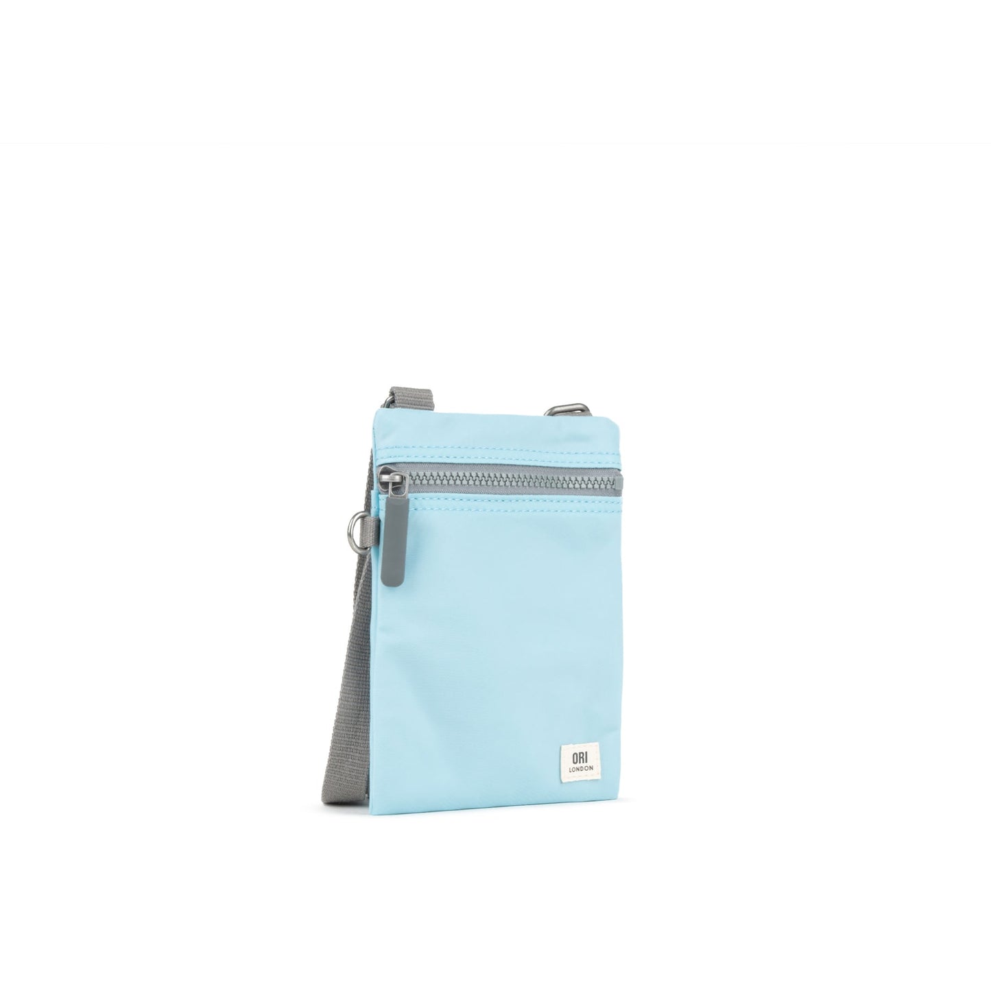 Light blue crossbody bag with front zipper, gray webbing strap, small logo patch