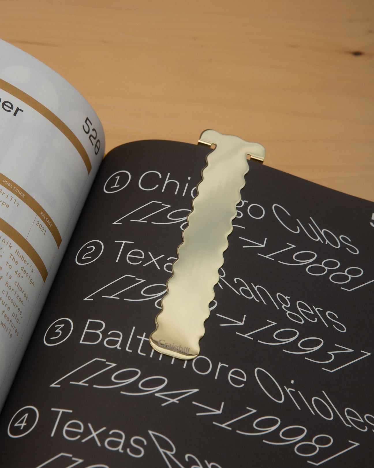 Brass perch-shaped bookmark