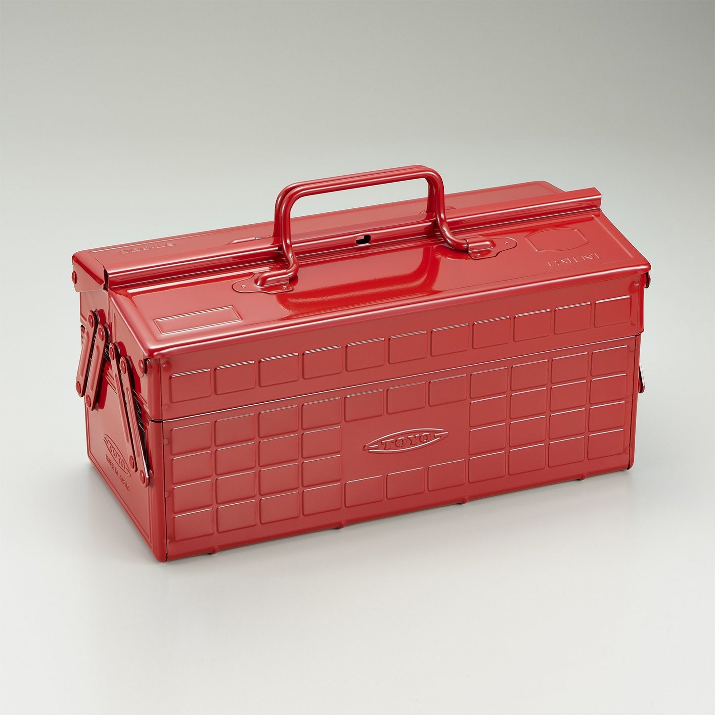 Red steel cantilever toolbox with top carry handle and front latch.