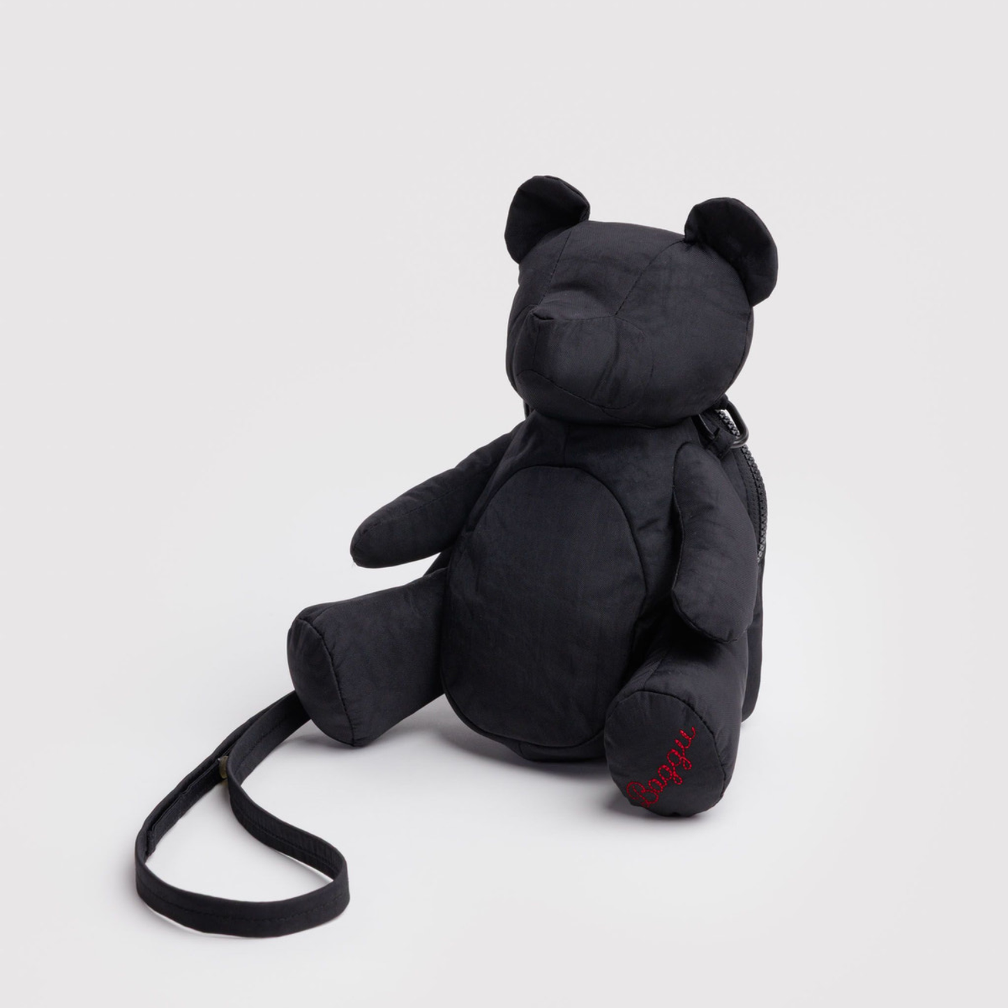 Black plush bear bag with long shoulder strap and small front pocket