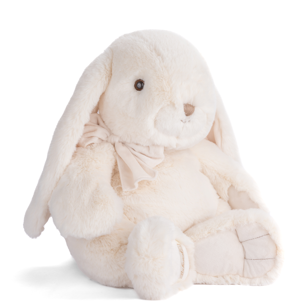 Cream seated plush rabbit with stitched face, beige bow detail and crossed paws