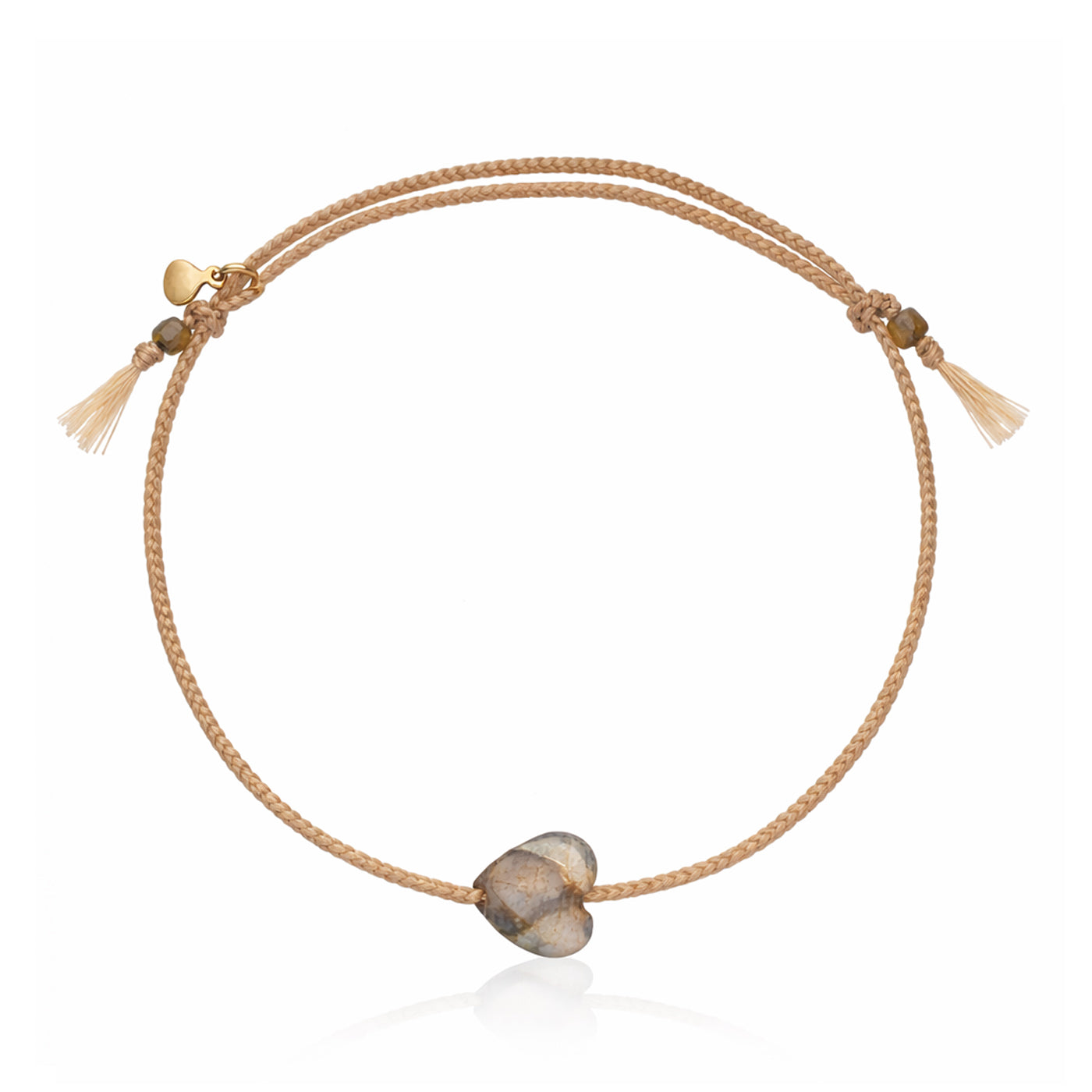 Tan cord bracelet with heart charm in gray-brown stone and tassel ends