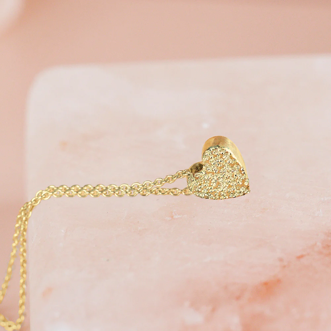 Gold-plated heart pendant necklace with diamond-dusted finish