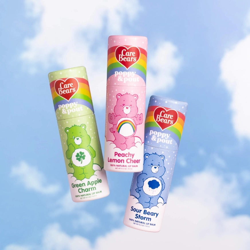 Three lip balm tubes: pink Peachy Lemon Cheer, green Green Apple Charms, blue Sour Berry Storm