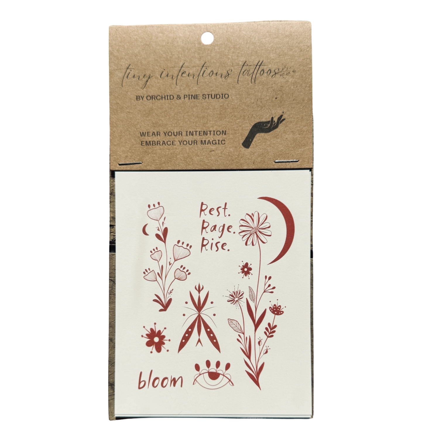 Henna-style temporary tattoo sheet with floral paws and moon, "Rest. Rage. Rise."