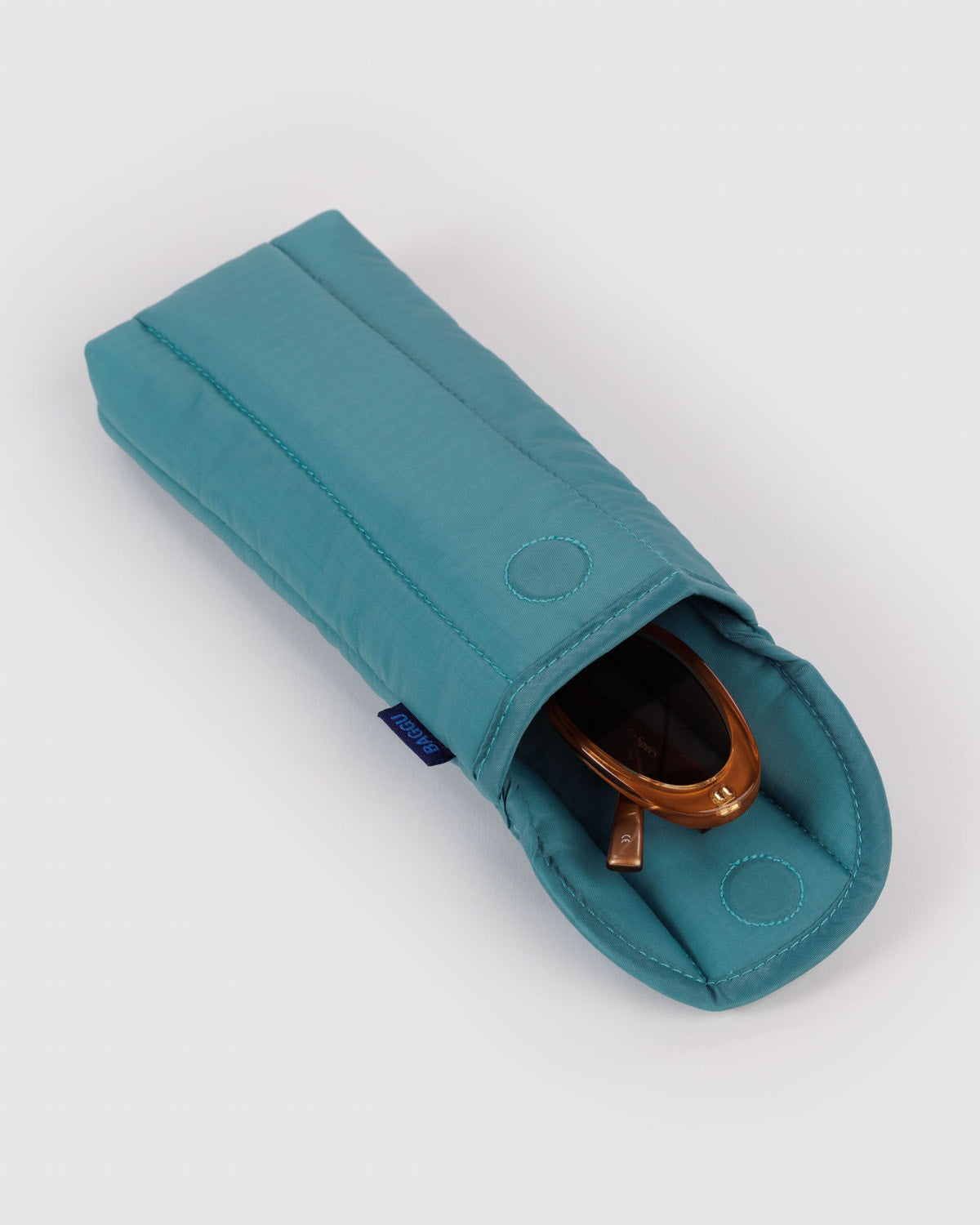Padded glasses sleeve in teal with sunglasses inside and round snap accents
